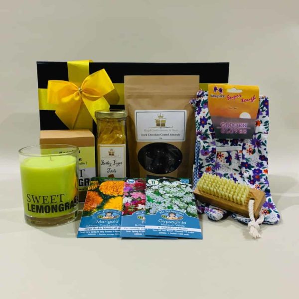 Garden Hamper image - Flowering seeds, cotton gloves, bamboo nail brush, lemongrass candle & choc coated nuts. Online or Phone: 03 5174 4888