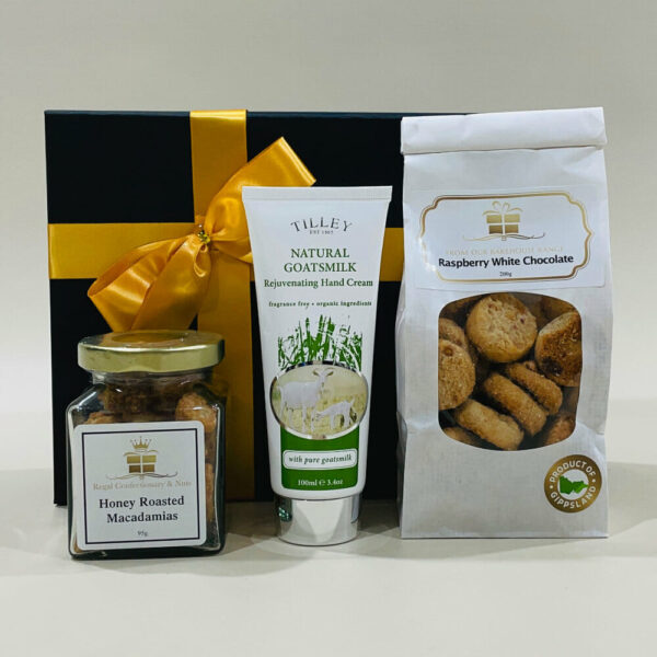 Corporate Gift Pack. An image of a Corporate Gift Pack containing a gift box with a jar of honey roasted macadamias. It also includes Goats Milk hand cream and a choice of Butter Shortbread, Raspberry & White Choc Biscuits, or Anzacs & nuts.