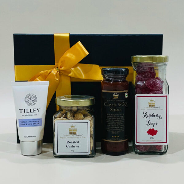 Indulgence Box Image. A choice of hard boiled lollies, a choice of sauces, quality nuts, chocolates and a choice hand & nail creams.