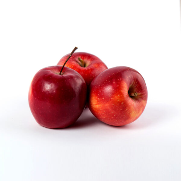 Red Apples x 3image. Three fresh red apples on a clean white surface.