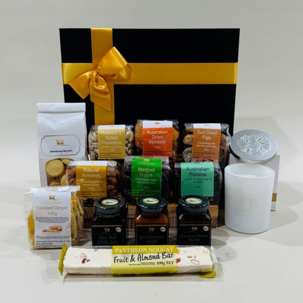 Eid al Fitr Hamper image. Indulge in Medjool dates almond & fruit nougat, raisins, almonds, shortbread, scented soy candles & gourmet treats